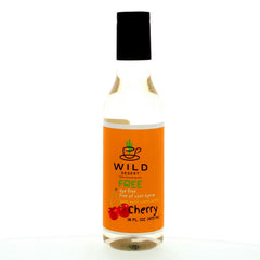 A 16 oz bottle of Wild Desert Dye-FREE Cherry Coffee Syrup from Hypothermias.com. The label is orange with a small cherry graphic and text indicating it’s dye-free, free of corn syrup, and made with 100% pure cane sugar. The bottle has a black cap and is perfect for adding a sweet cherry flavor to coffee and other beverages.