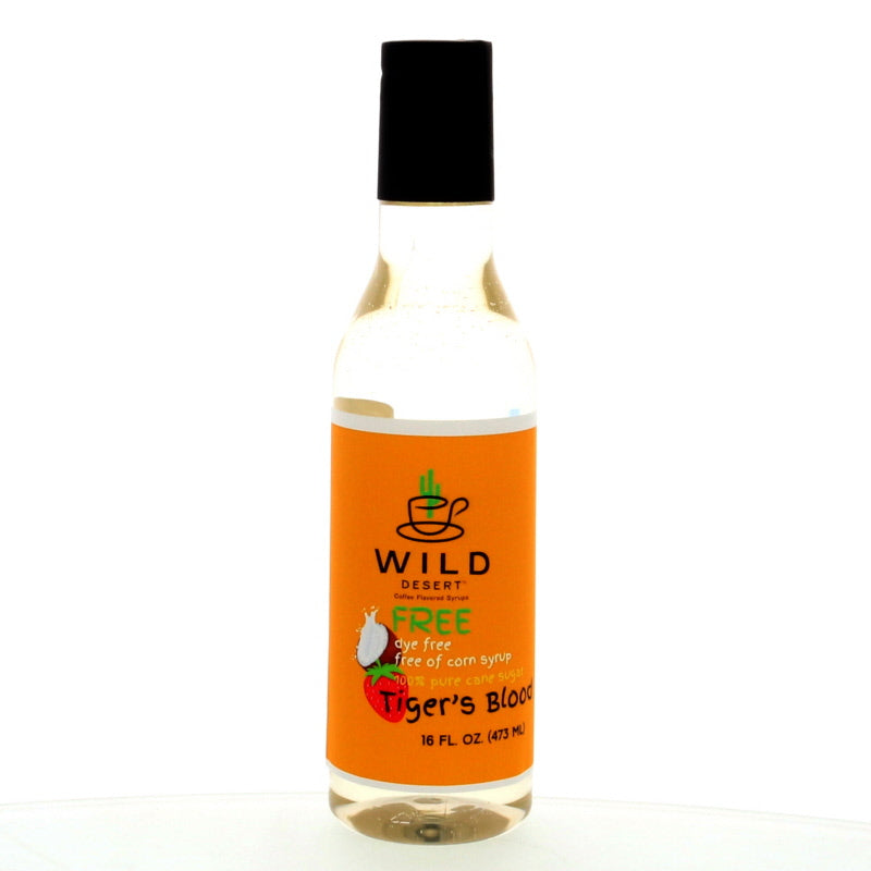 A 16 oz bottle of Wild Desert Dye-Free Tiger's Blood Coffee Syrup with an orange label, showcasing its natural, dye-free ingredients and non-GMO 100% pure cane sugar.